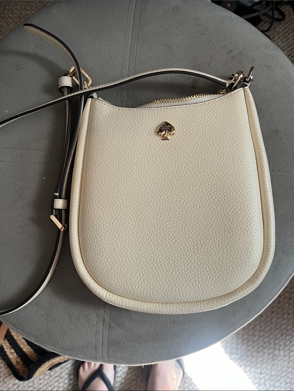 kate spade Cream Pebbled Leather Saddle Crossbody with Gold Spade Logo